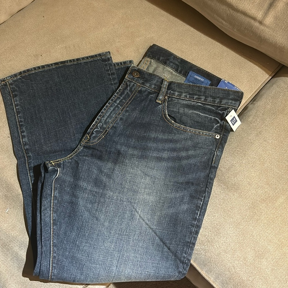 New with tags Gap men’s jeans size 38/30. Dark wash with faded detail